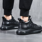 Black lace-up sneakers, side view with low-profile rubber sole