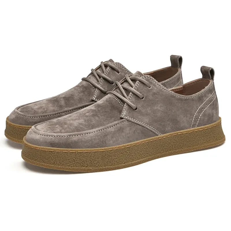 Suede lace-up sneakers with rounded toe and gum rubber sole, front view