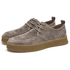 Suede lace-up sneakers with rounded toe and gum rubber sole, front view