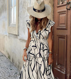 Mila™ sleeveless tiered dress with black geometric lines on light fabric