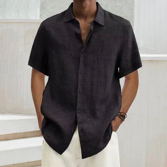 Dark charcoal short-sleeve button-up shirt with point collar and button front