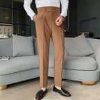 Camel tan dress pants with button fly, belt loops, and tailored straight legs