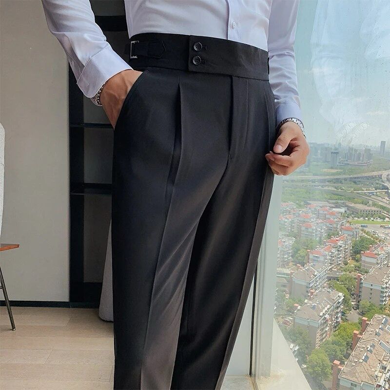Black dress pants with button closure, belt loops, and neatly pressed pleats