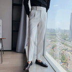 Light gray dress pants with belt loops, pleated front, and straight leg fit