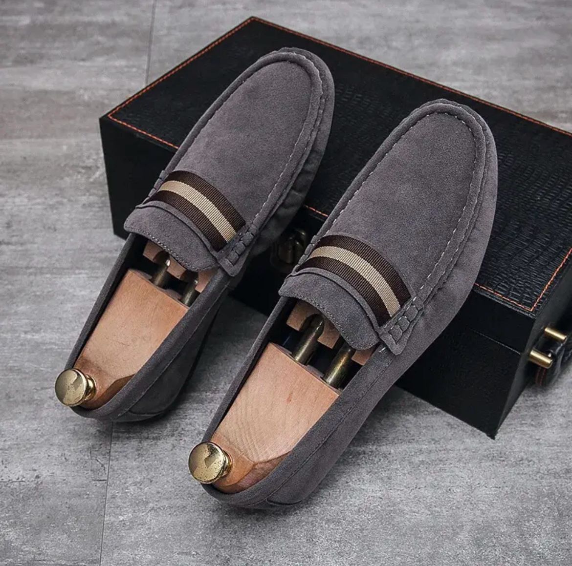 Gray suede slip-on instapper loafers with striped band at vamp