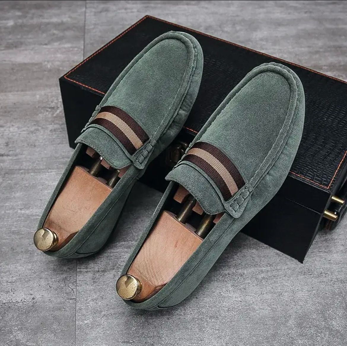 Green suede slip-on instapper loafers with striped band at vamp