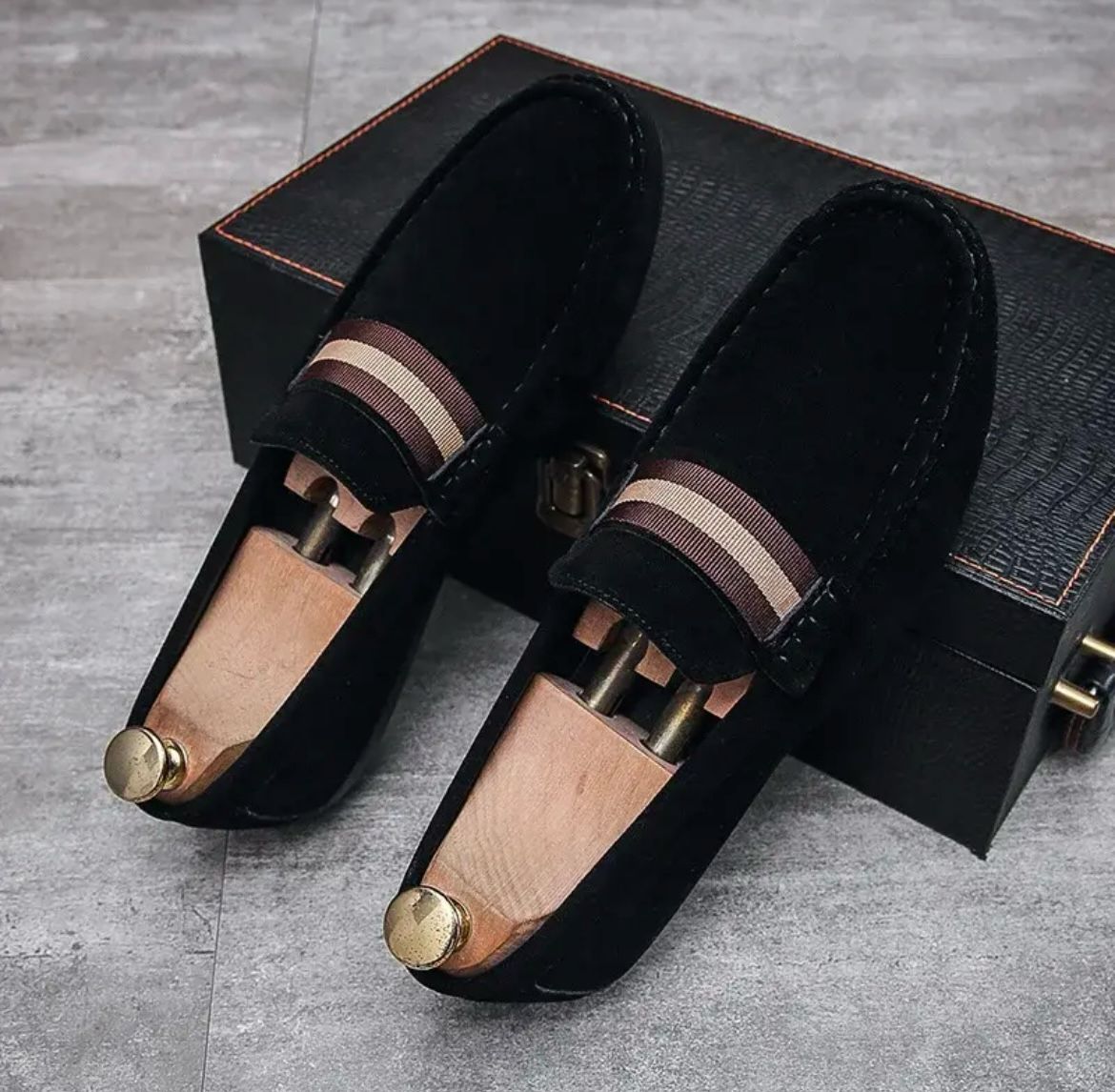 Black suede slip-on instapper loafers with striped band at vamp