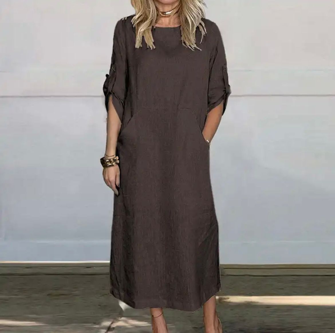 Dark brown textured midi dress, crew neck, short sleeves with button details.