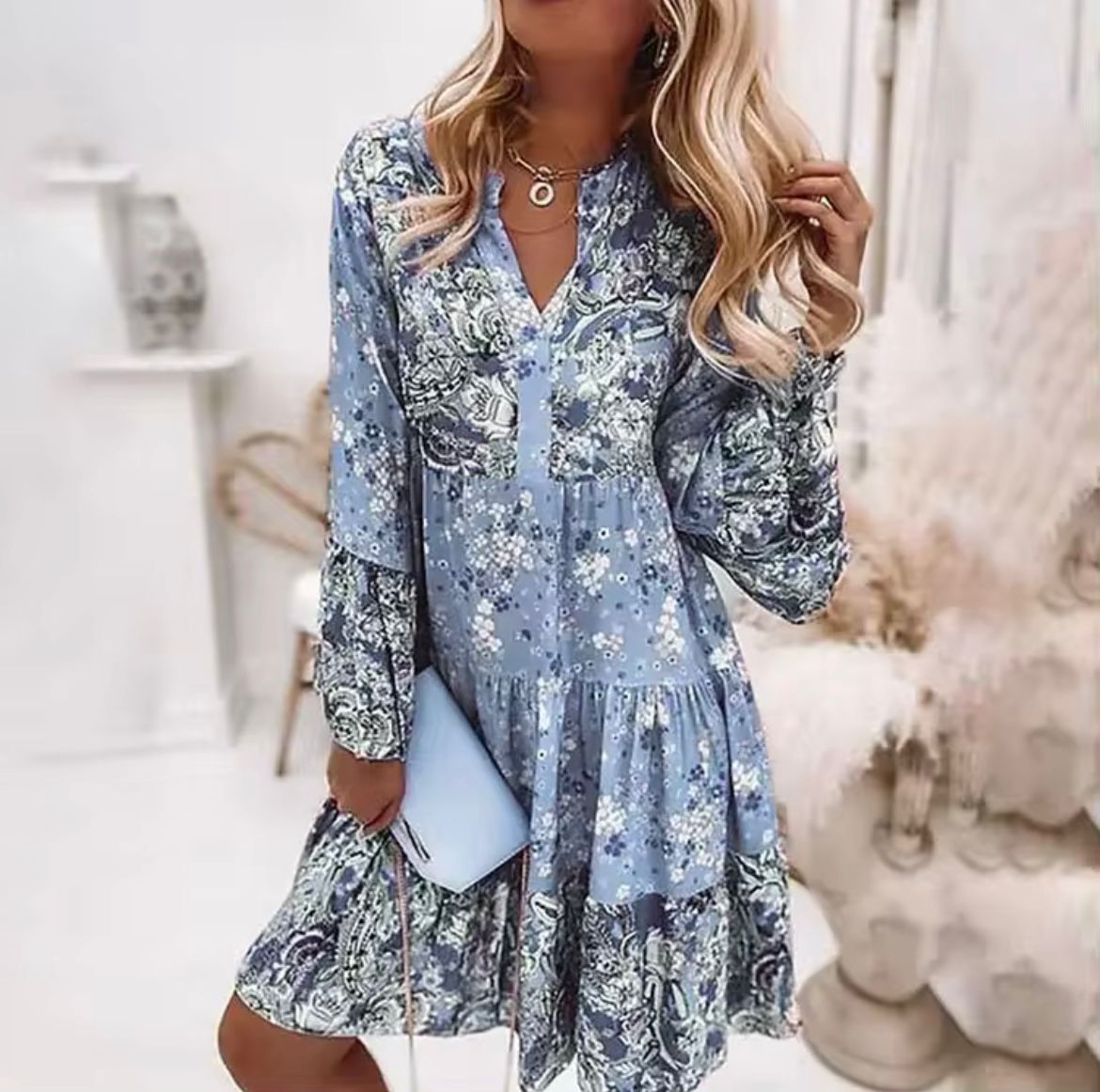 Blue printed long-sleeve tiered dress with V-neck and ruffled skirt