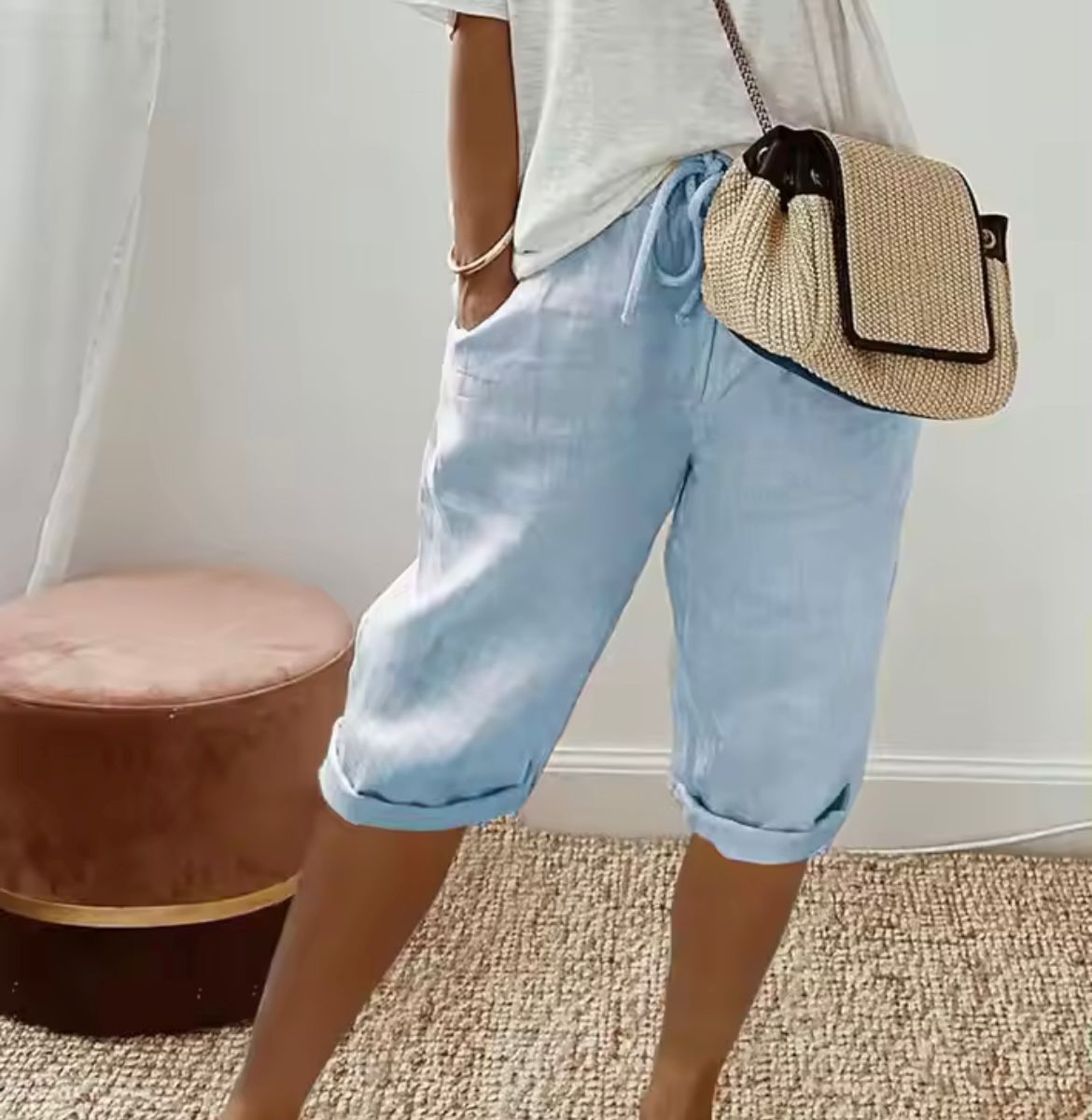Light blue short women's pants with cuffed hems