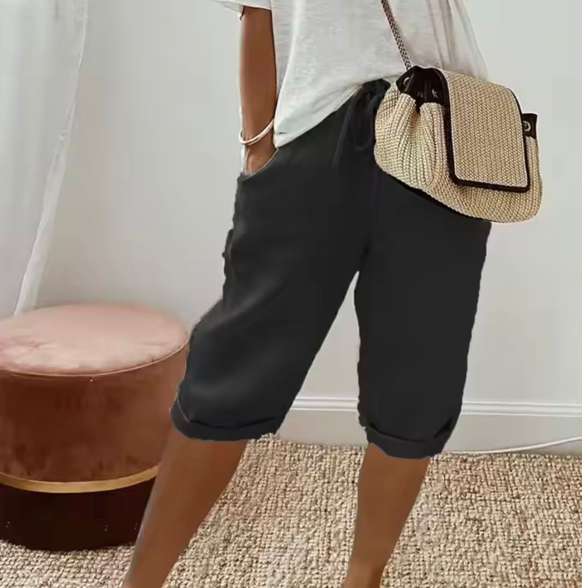 Black cropped womens pants with drawstring waist and relaxed cuffed hem