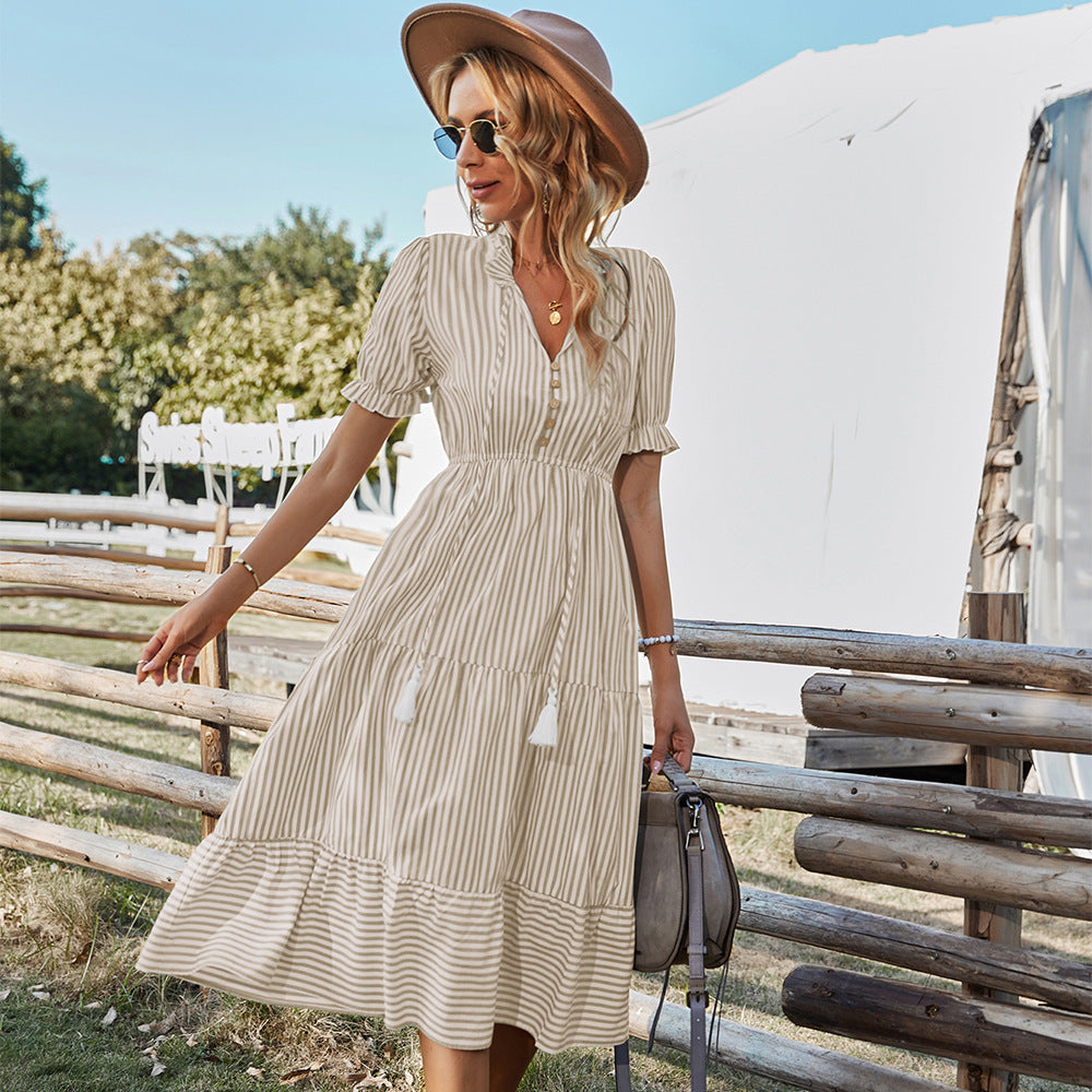 Beige striped midi shirt dress with tiered skirt, puff sleeves, and button front