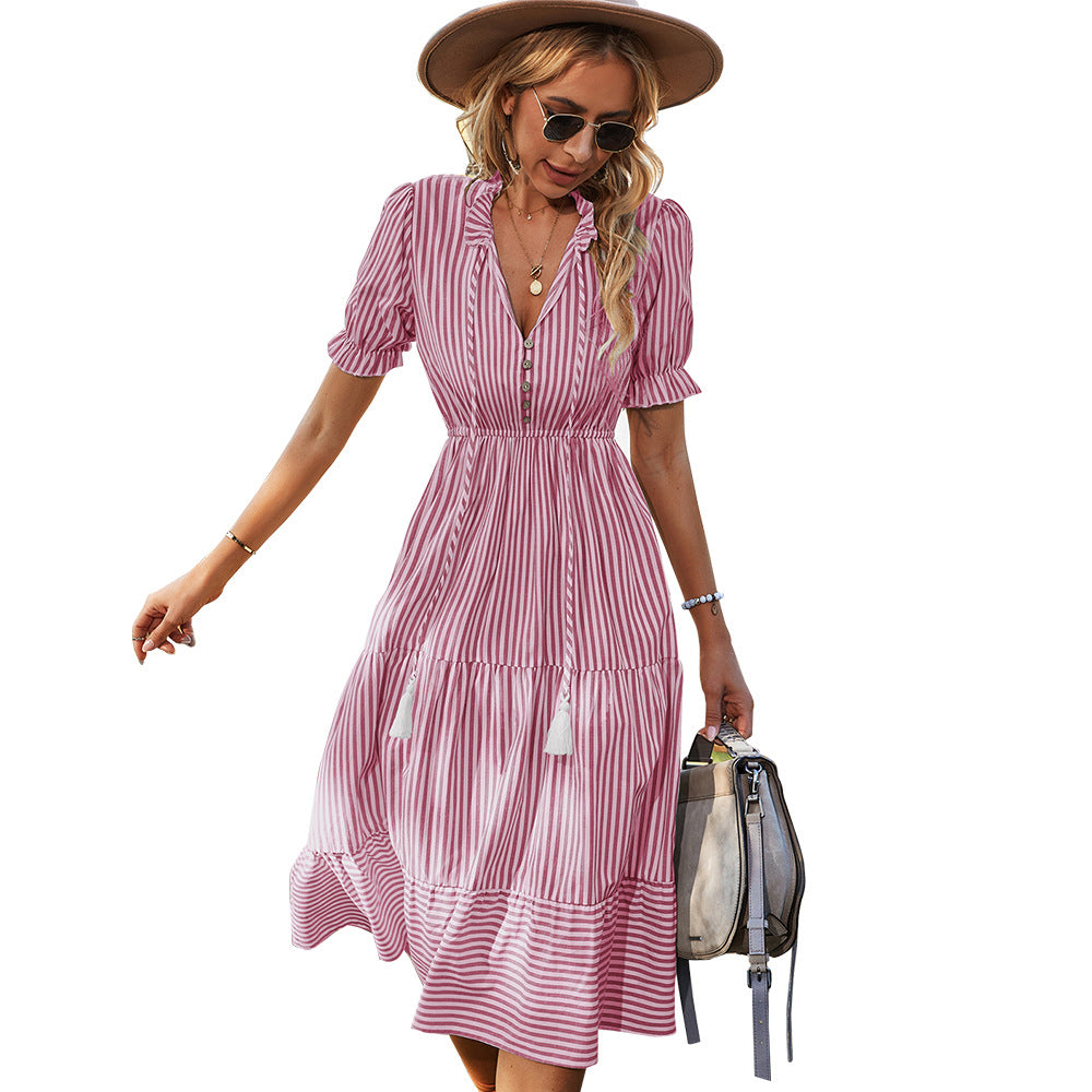 Pink striped midi shirt dress with tiered skirt, puff sleeves, and button front