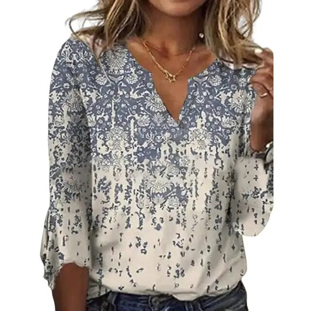 Women's airy blouse top with blue-gray and white scattered floral abstract print