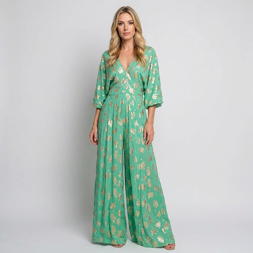 Bohemian maxi dress with V-neck, green floral print, three-quarter sleeves, flowing hem