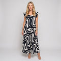 Sleeveless maxi dress with abstract black-and-white swirl print, short ruffle shoulders