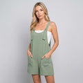 Light green casual summer playsuit with front pockets and tie shoulder straps