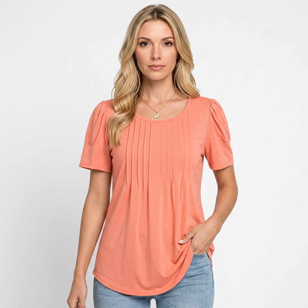 Loose-fit crewneck T-shirt in coral pink with short sleeves and vertical pleated front