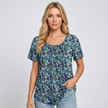 Loose-fit crewneck T-shirt, blue floral print with short sleeves and front pleats