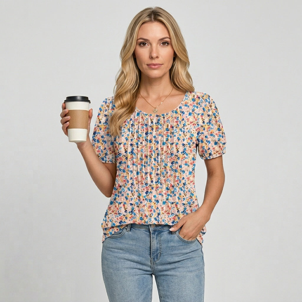 Loose-fit crewneck T-shirt with small multicolor floral print, short sleeves and pleats