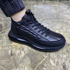 Black lizard-pattern lace-up high-top sneakers with thick dark sole and side stripe lines
