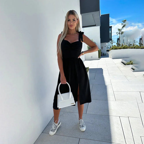 Black sleeveless summer dress with square neckline and gathered skirt