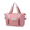 Pink waterproof sleeping bag carrier with top handles and side carry straps
