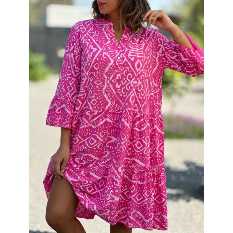Women's summer dress in fuchsia pink with bold geometric print and tiered ruffle hem