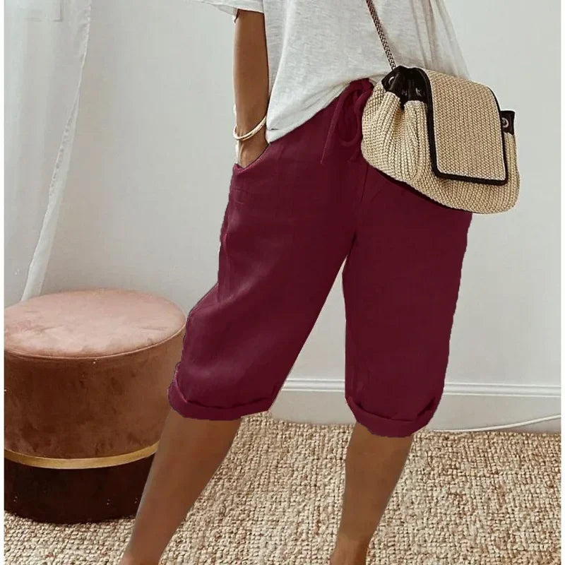 Burgundy cropped womens pants with drawstring waist and relaxed cuffed hem