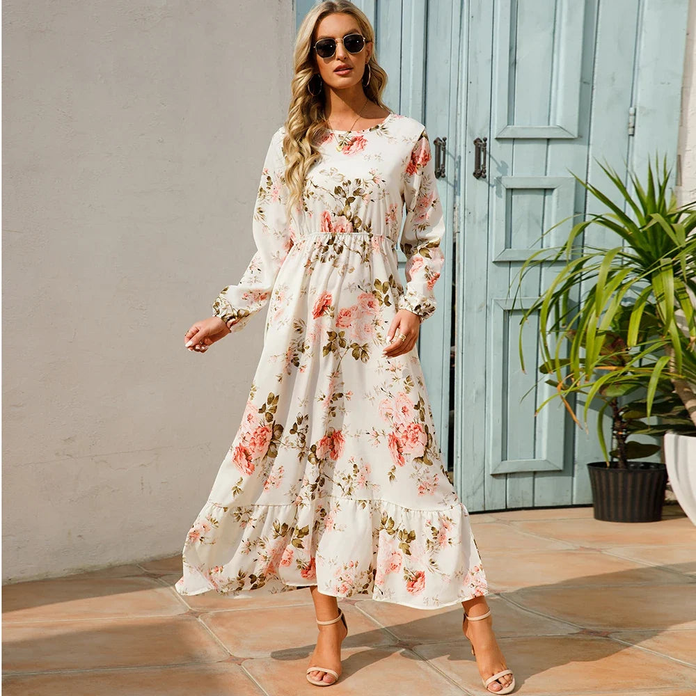 Cream floral maxi dress with long sleeves and gathered waist with tiered skirt