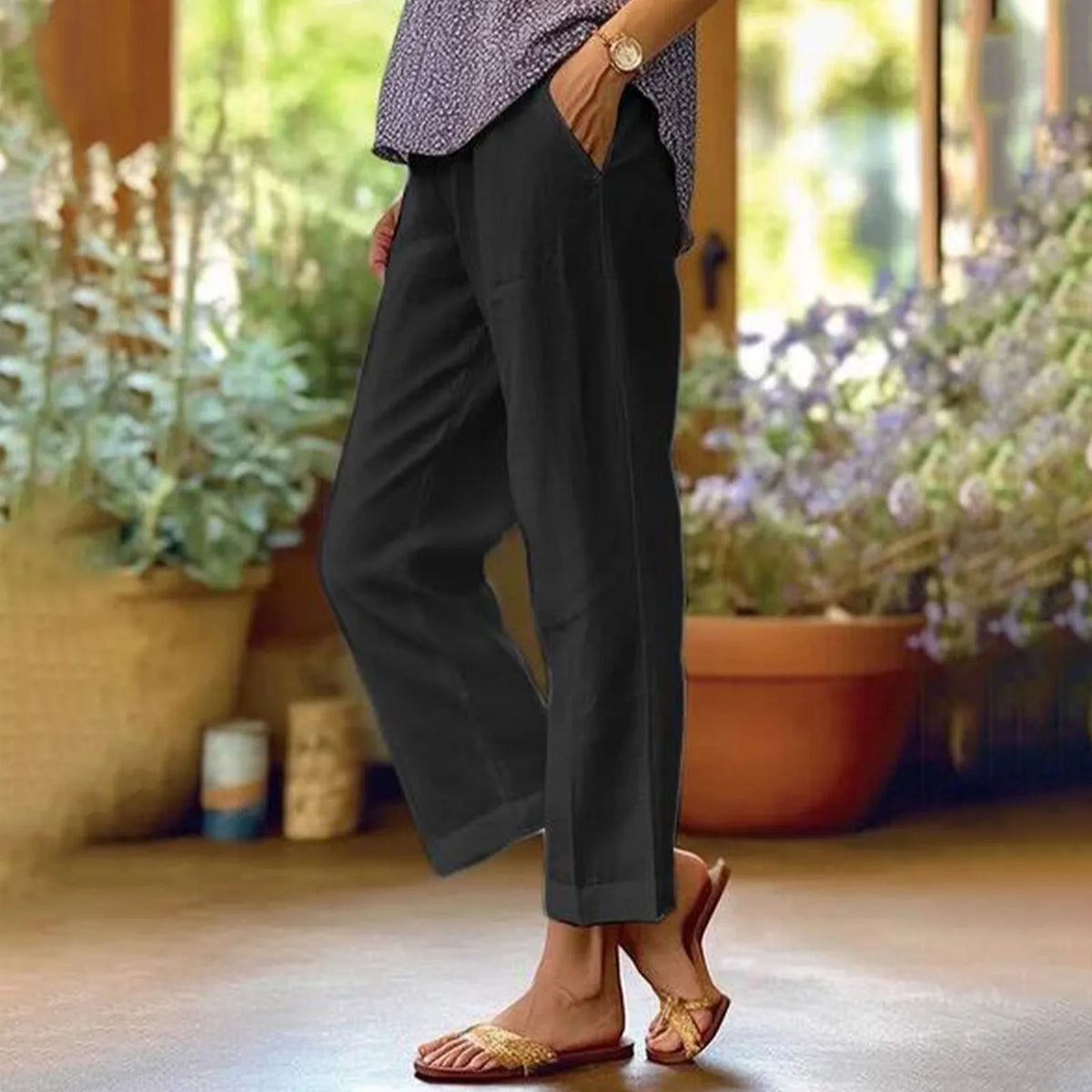 Black ankle-length stretch pants with relaxed straight legs.