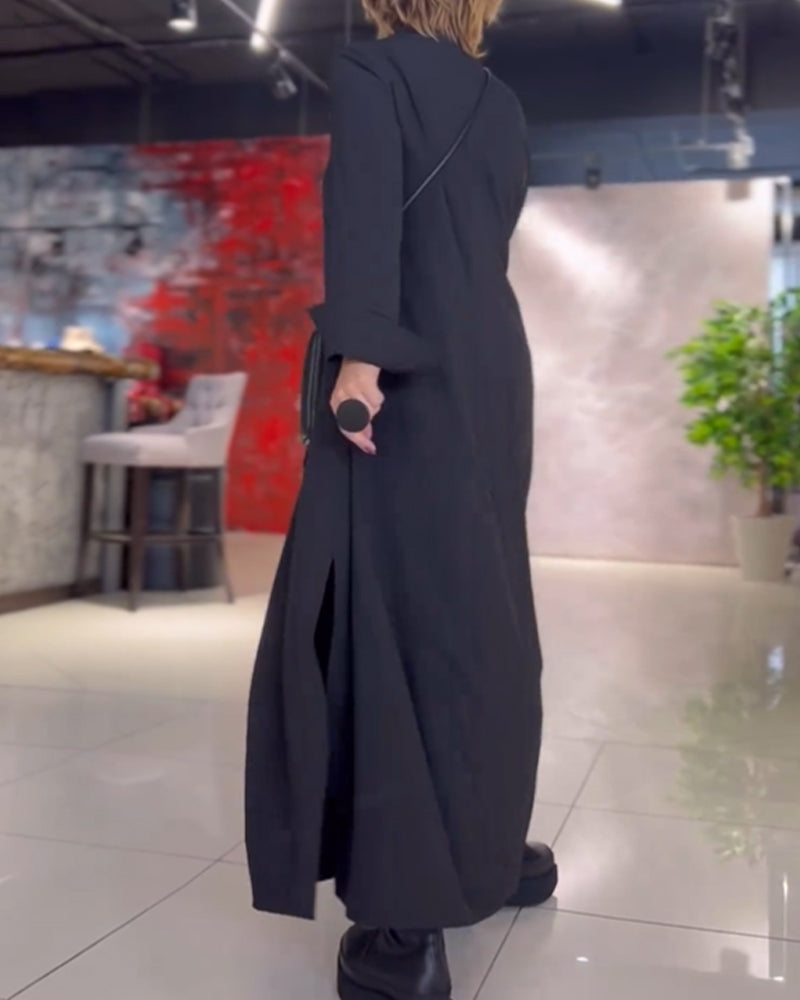 Black maxi dress with V-neck and three-quarter sleeves, open draped back.