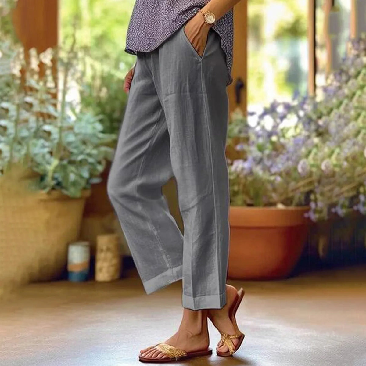 Gray ankle-length stretch pants with relaxed straight legs.