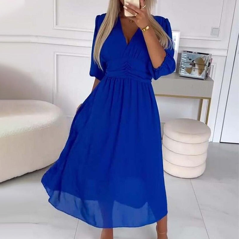 Blue V-neck midi dress with puff sleeves and gathered waist