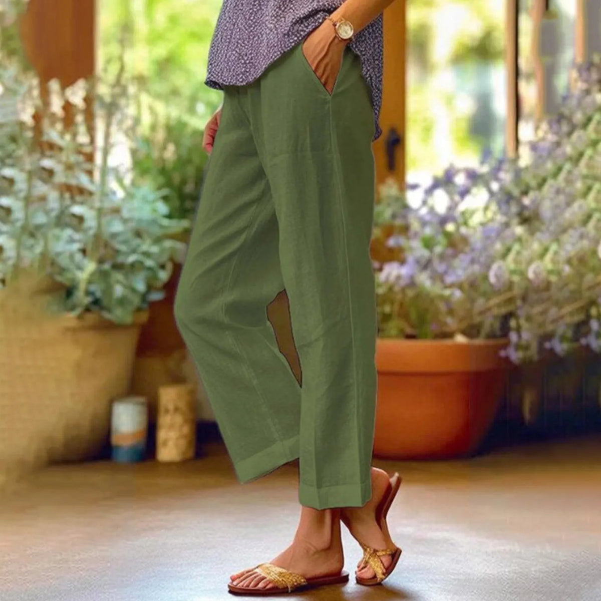 Green ankle-length stretch pants with relaxed straight legs.