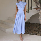 Light blue sleeveless midi dress with high neck and gathered waist
