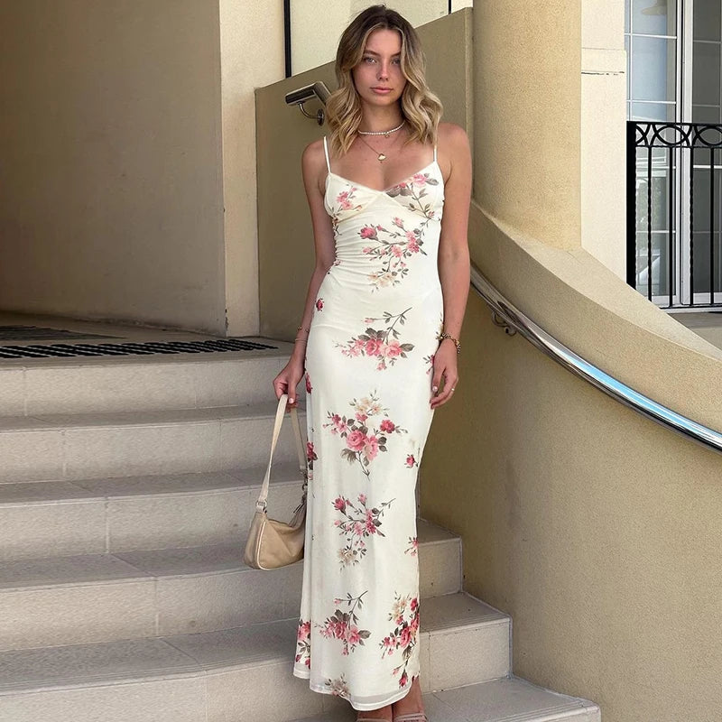 White floral maxi summer dress with spaghetti straps and fitted bodice