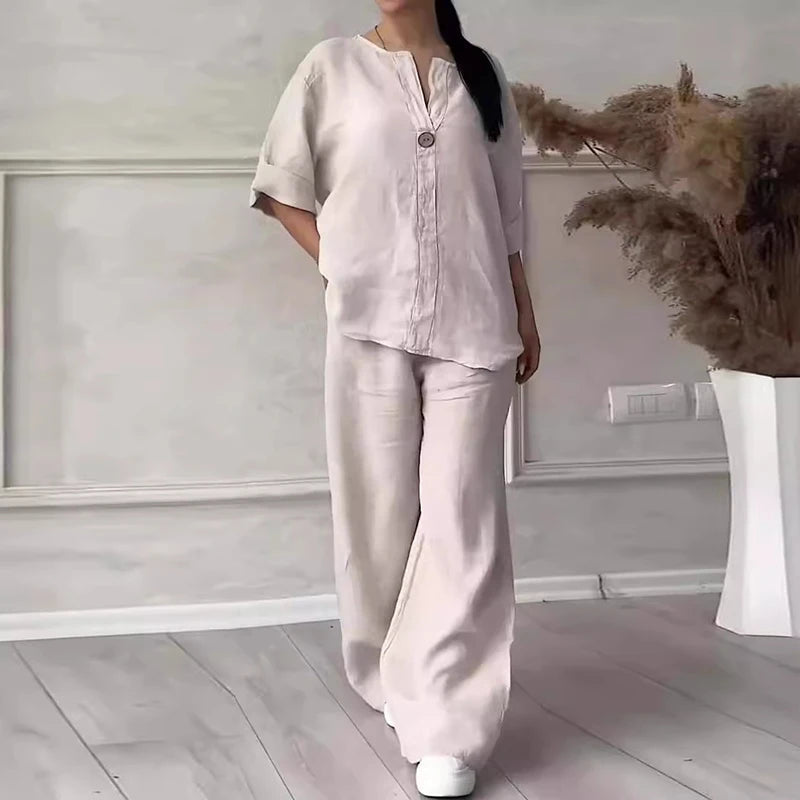 White linen set with short-sleeve button top and wide-leg pants