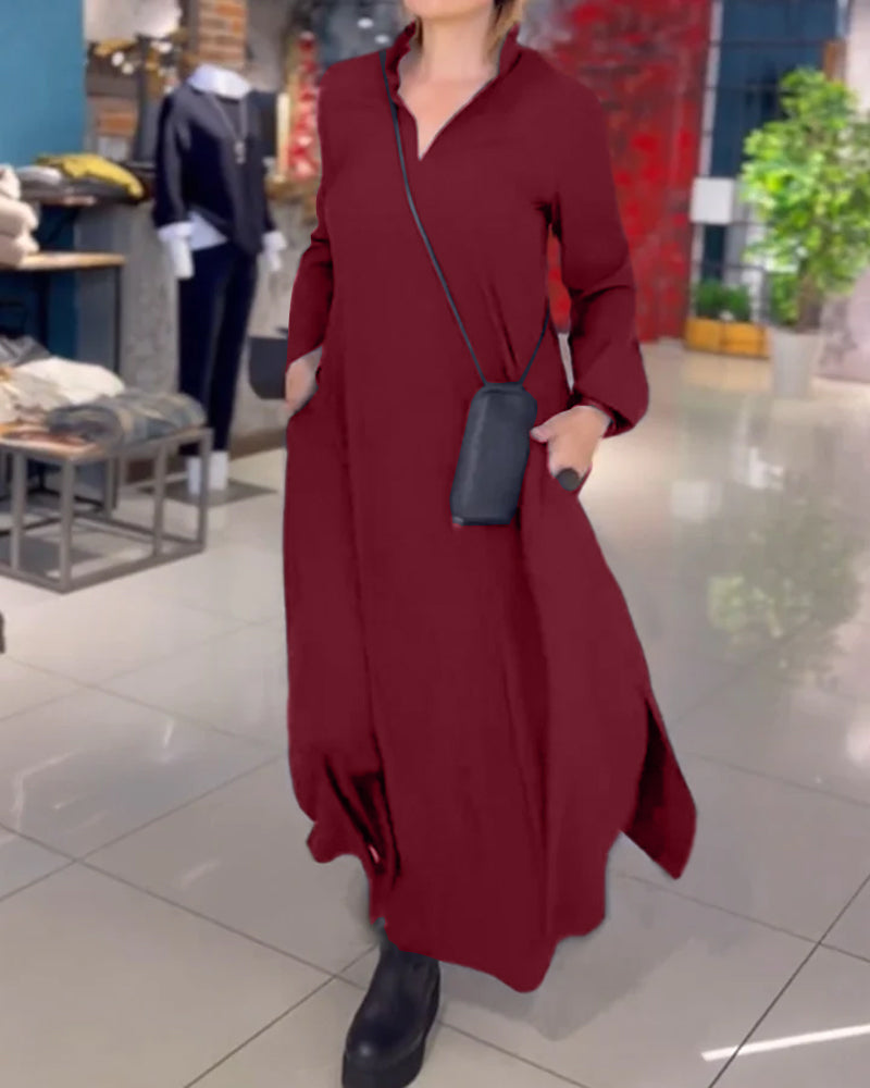 Burgundy V-neck maxi dress with three-quarter sleeves and wrap-style waist.