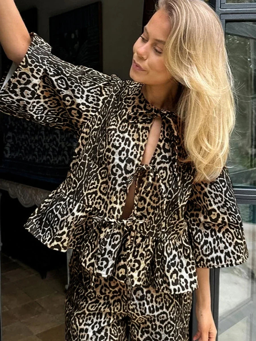 Leopard print peplum top with cutout shoulders and drawstring pants set