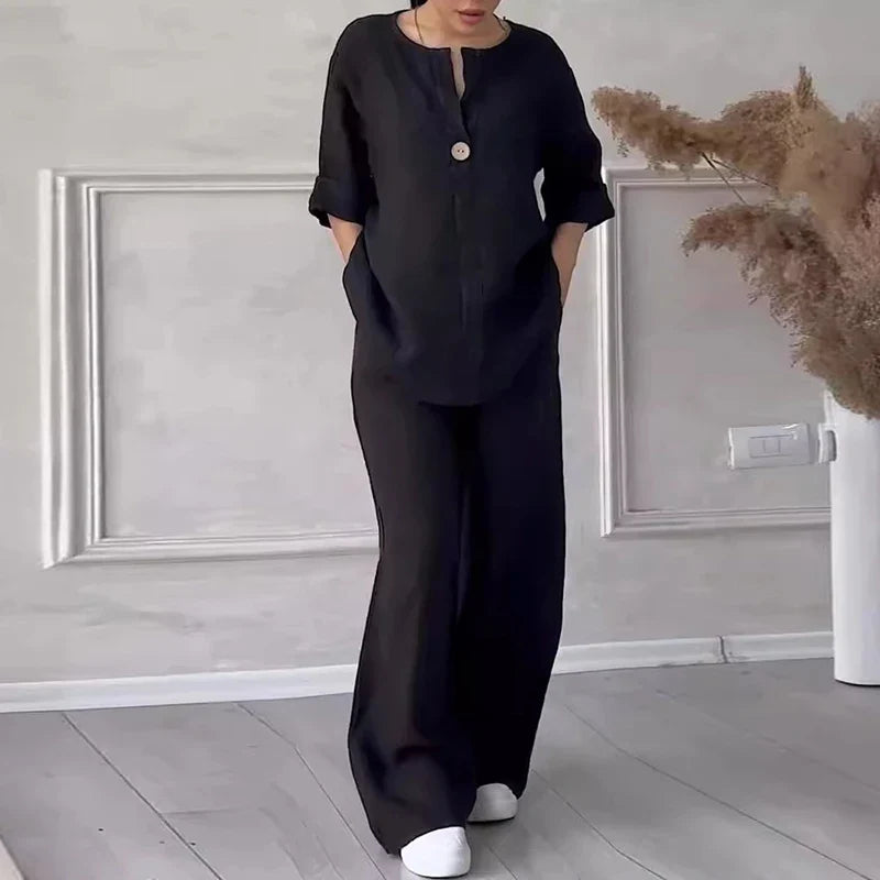 Black linen lounge set with button-front short-sleeve top and wide-leg pants