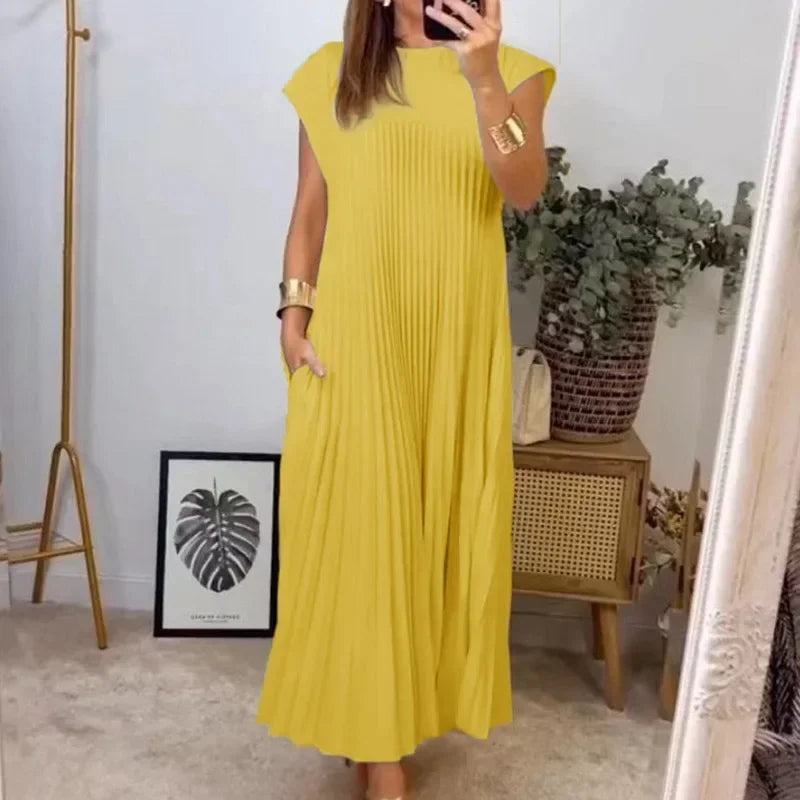 Yellow pleated maxi dress with cap sleeves and soft draped skirt