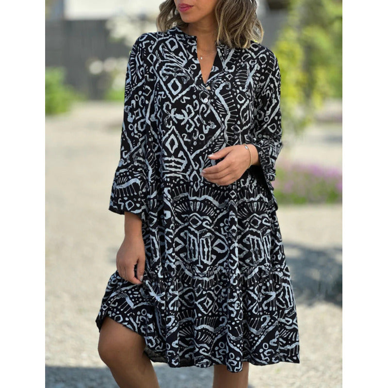 Women's summer dress in dark navy with white abstract geometric print and ruffle tiers