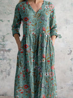 Teal floral maxi dress with V-neckline and button placket, three-quarter sleeves