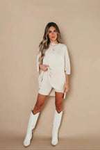 Women’s cream weekend set with loose top and matching high-waist biker shorts.