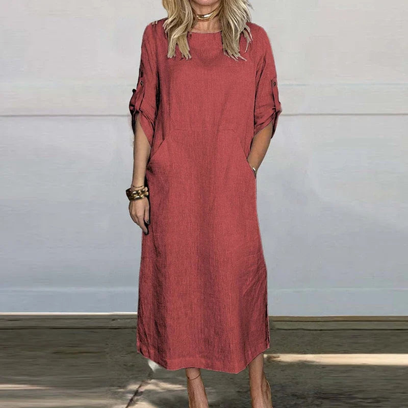Rust red textured midi dress, crew neck, short sleeves with button details.