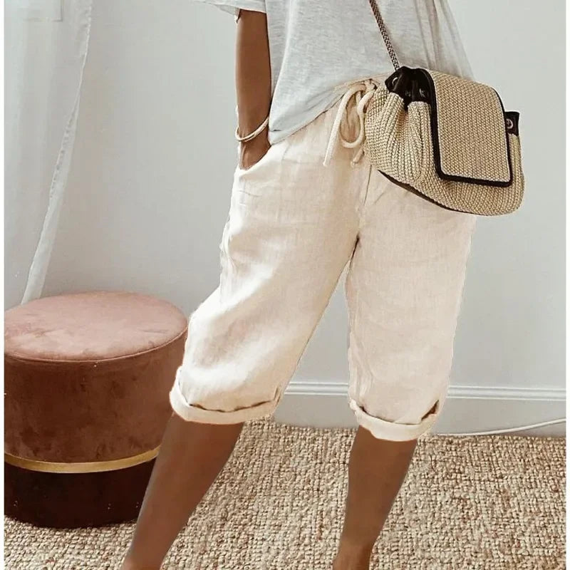 White cropped womens pants with drawstring waist and relaxed cuffed hem