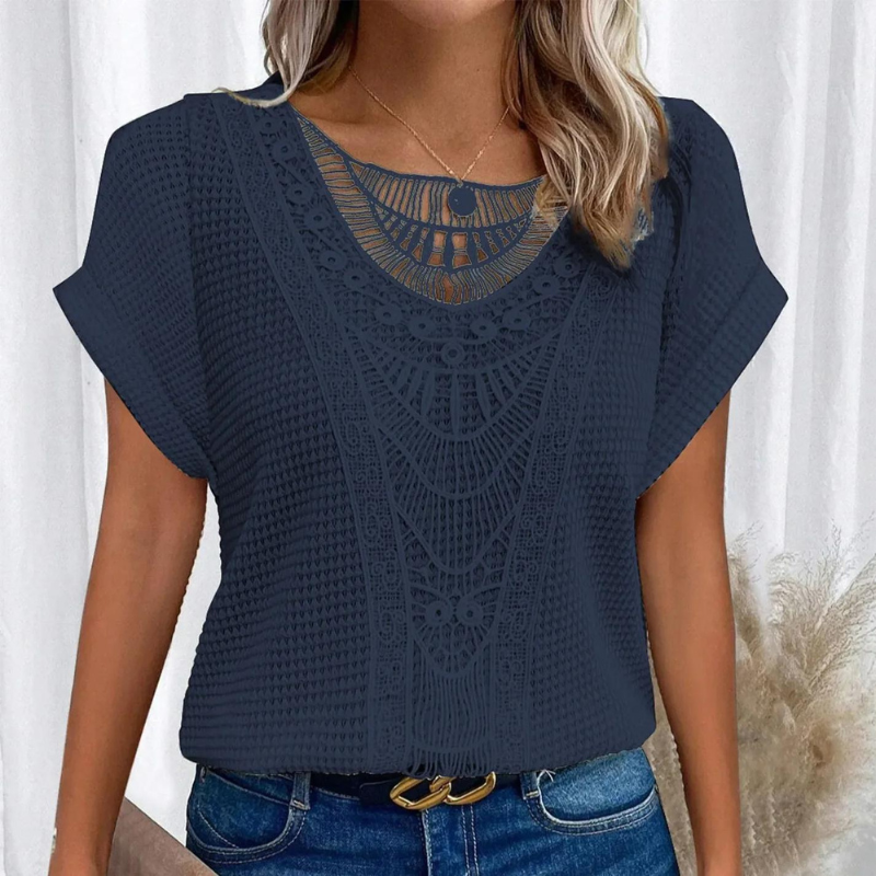 Elegant top in dark navy with lace-look yoke, short sleeves, round neckline button