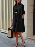 Black button-front stylish dress with collar and long sleeves, knee length