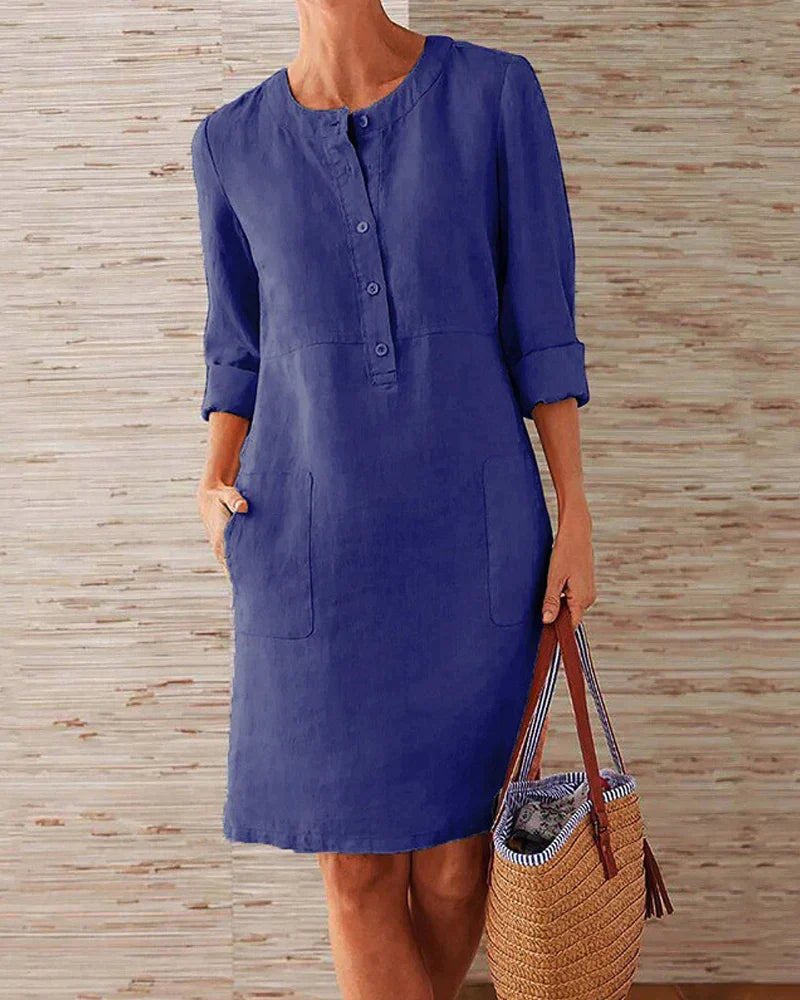 Dark blue button-front summer dress with three-quarter sleeves and side pockets